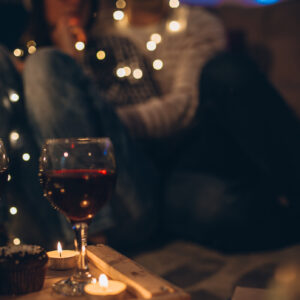 Young couple sitting on the floor enjoying the Christmas night